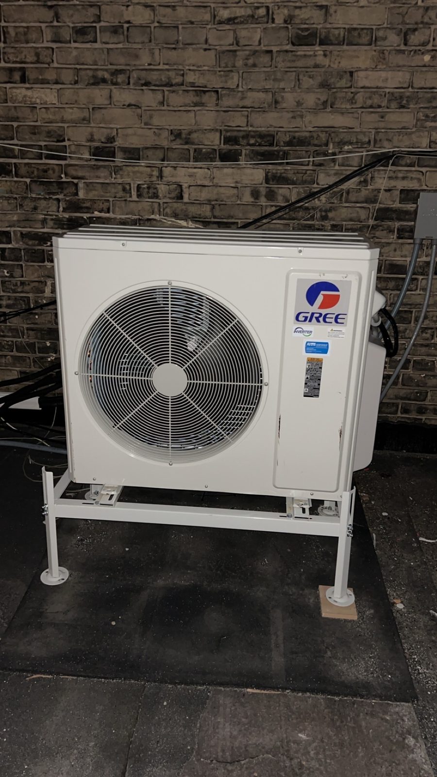 GREE outdoor inverter condensing unit installed at a residential property